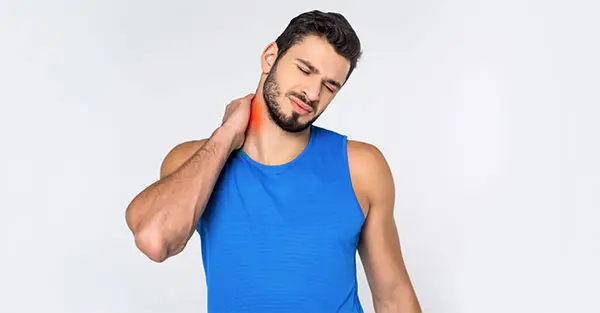 man holding neck in pain