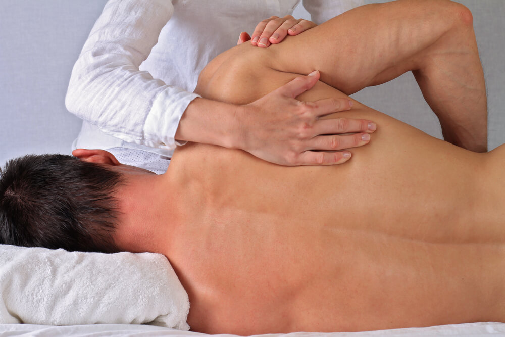 What treatments do physical therapists use for breaking up scar tissue?