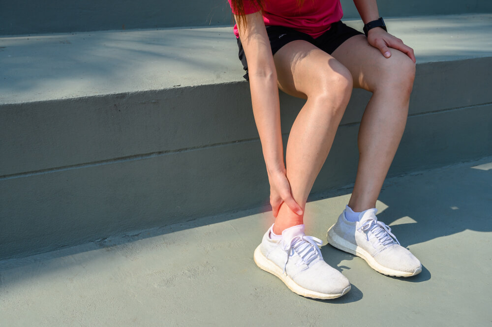 What commonly causes pain in the side of the ankle? shutterstock 1616927470 side of ankle pain