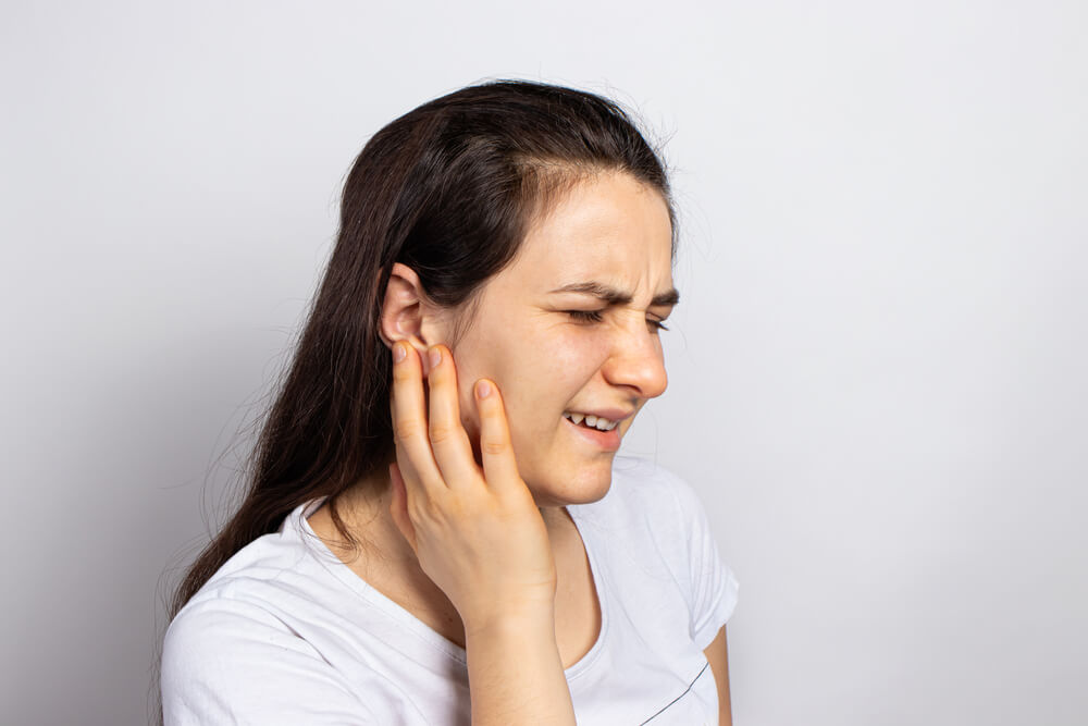 Does TMJ dysfunction cause headaches and what can physical therapy do to help? shutterstock 1880807755 tmj headache
