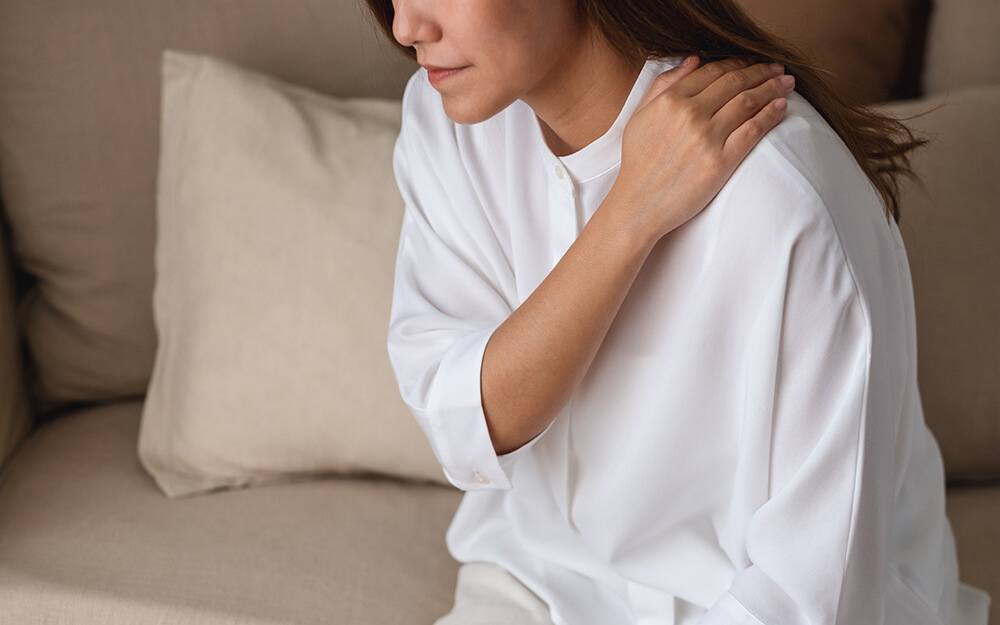 Shoulder pain and 4 other surprising TMJ symptoms closeup image of a sick woman suffering from backa 2022 12 16 05 36 59 utc shoulder pain and 4 other surprising tmj symptoms shoulder pain