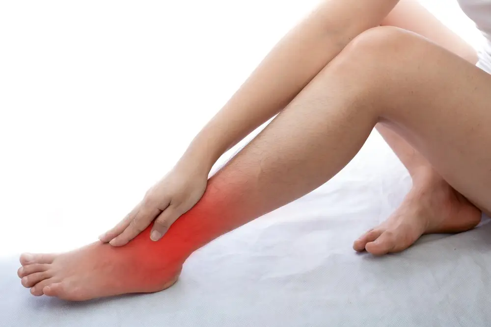 Stiff ankles in the morning: 5 common causes and treatments that can help young woman with ankle pain at white background 2022 11 02 16 31 14 utc 1 stiff ankles in the morning: 5 causes & treatments
